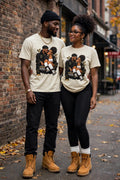 A Love Built Different matching couple wearing cream vintage T-shirts on a city street