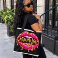 Miss Me Yet? tote bag with black straps, white trim, pink lips and gold lettering carried by a model outdoors